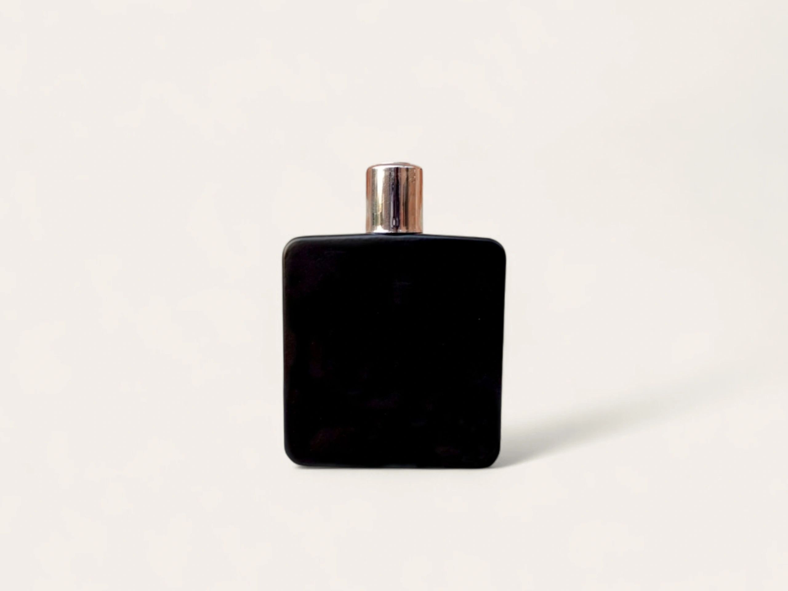 elegant perfume bottle with dramatic lighting